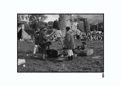 Stanley gets Dave Tomblin to arrange his army while crew set up the camera by norrie maclaren