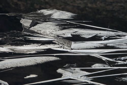 ice forming, loch carrie by nigel mcmillan
