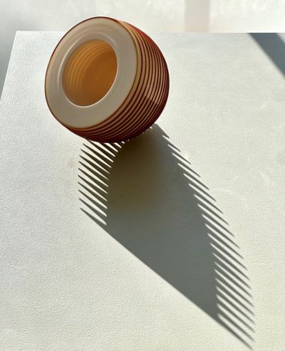 Small Rust Orange Floating Bowl by nicholas lees