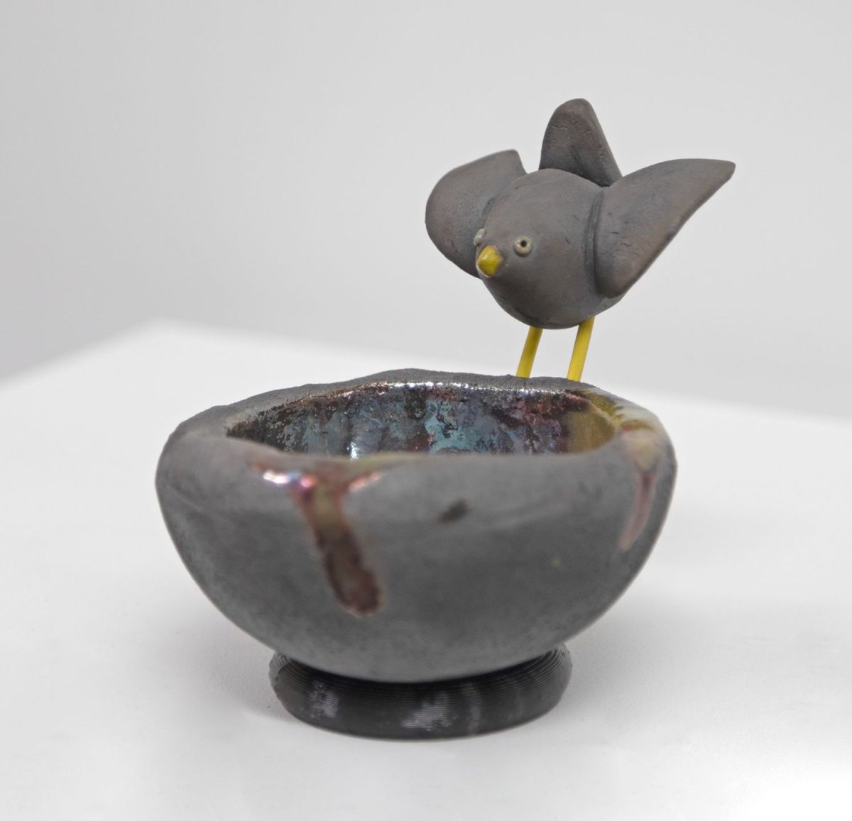 raku bird's nest, with black bird by Chris Barnes